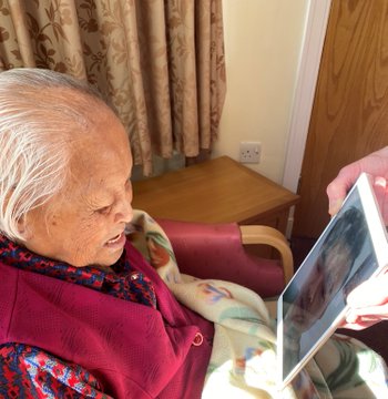 Grandmother using iPad to speak to her Grandson